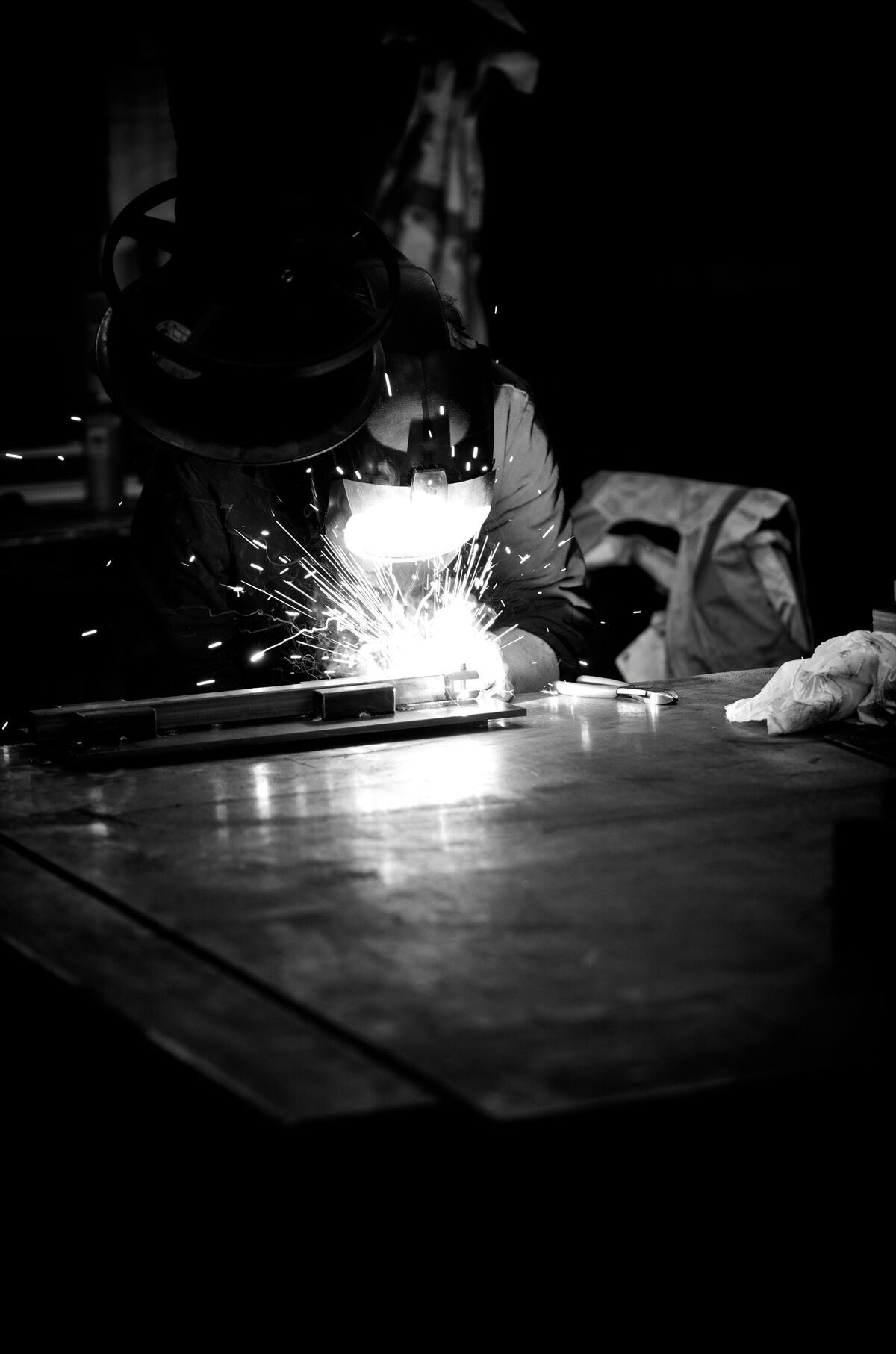 Welder at work with sparks flying